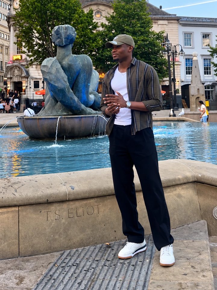 Emmanuel Edokpa by a fountain in Birmingham